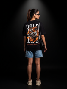 "Bold Legacy tiger graphic tshirt back view female model orange graphic black tshirt"