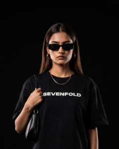 "Sevenfold Bold Legacy tshirt female model black studio SEVENFOLD text close up"