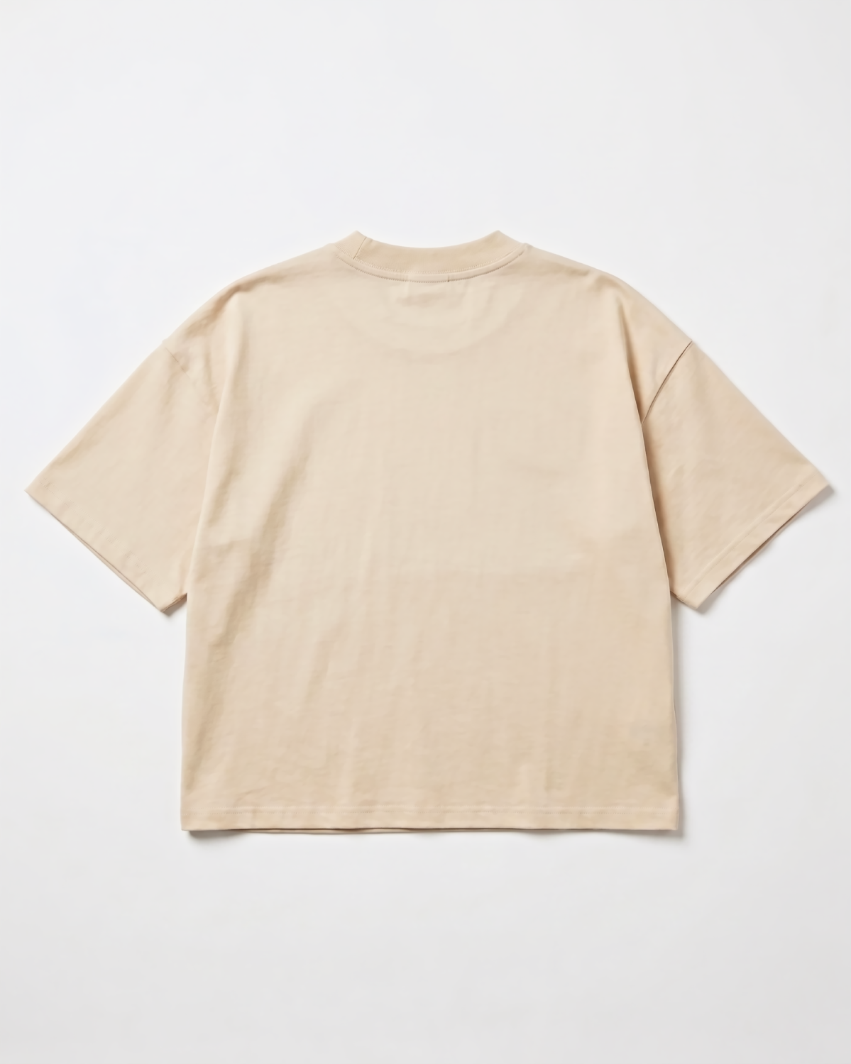 Sevenfold Quiet Crop Tee in Beige - Front Editorial Shot with Black Trousers | Drop 003