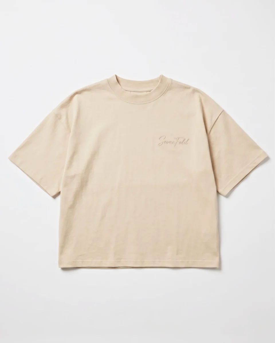 Sevenfold Quiet Crop Tee in Beige - Front Editorial Shot with Black Trousers | Drop 003