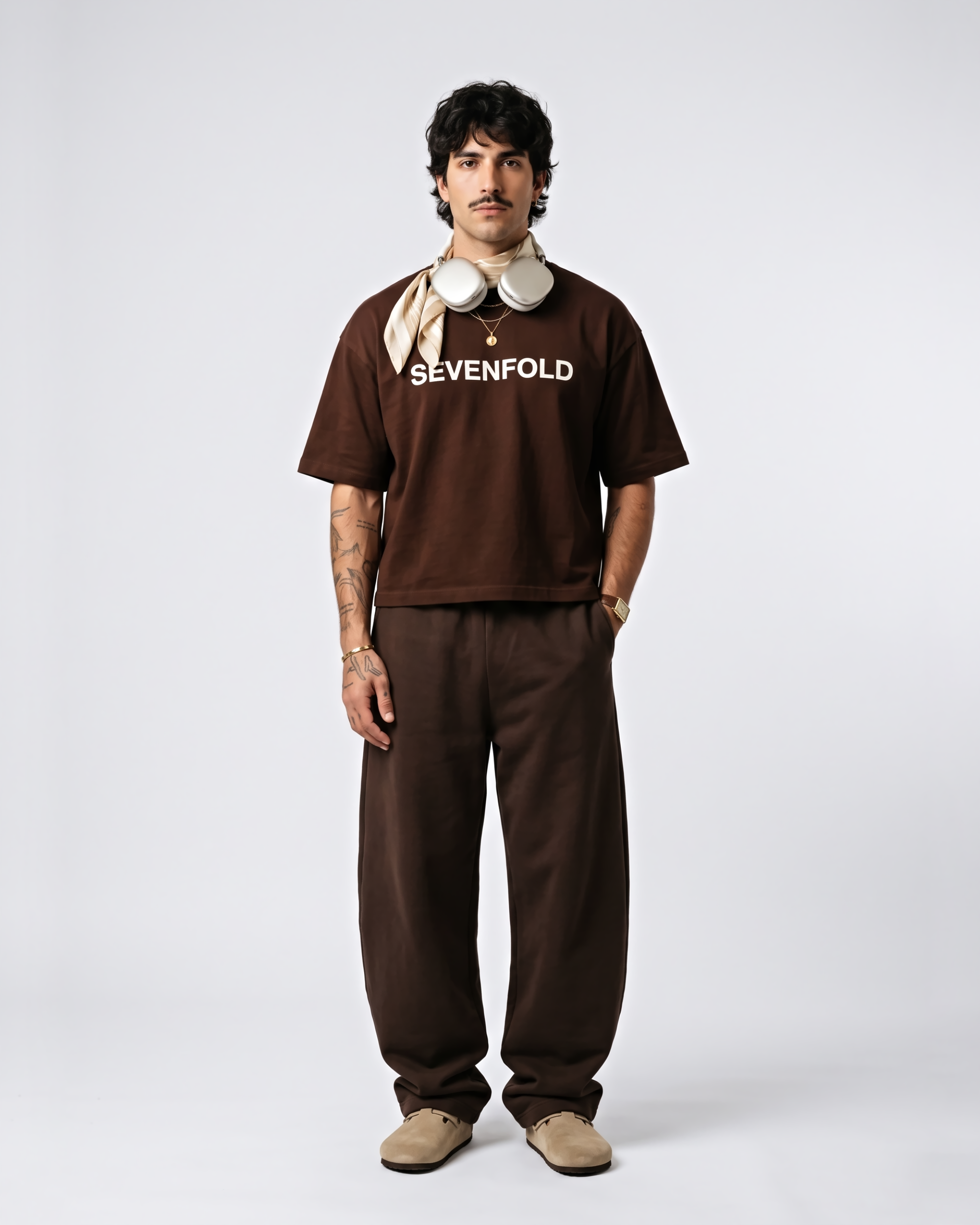 Model wearing brown Rome graphic oversized T-shirt SEVENFOLD