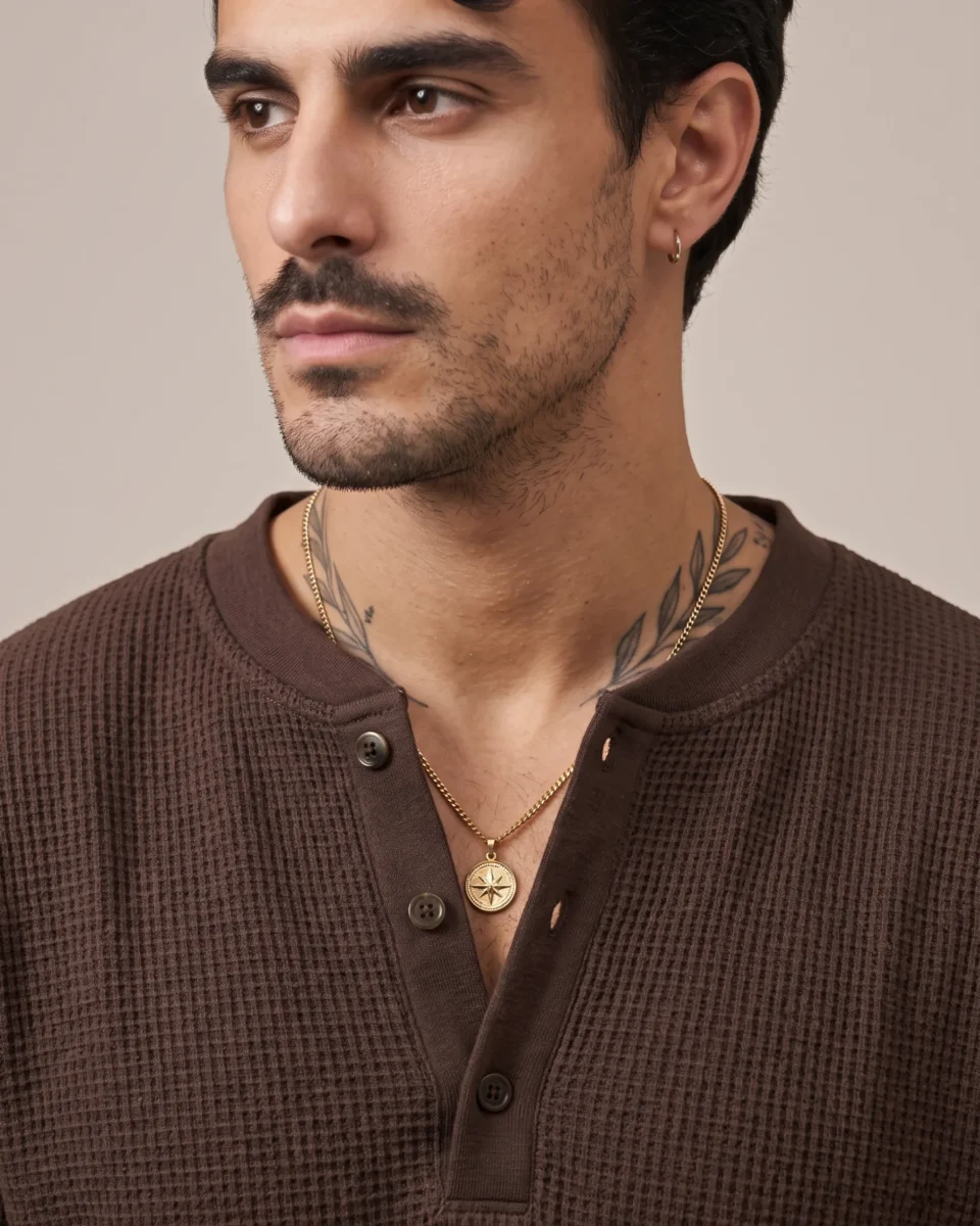 Close-up of the brown waffle Henley fabric, neckline, and button placket