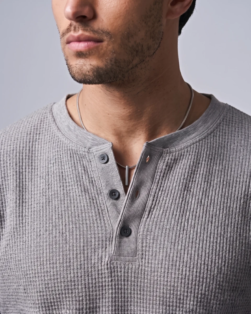 Grey waffle Henley three-button neckline and textured fabric